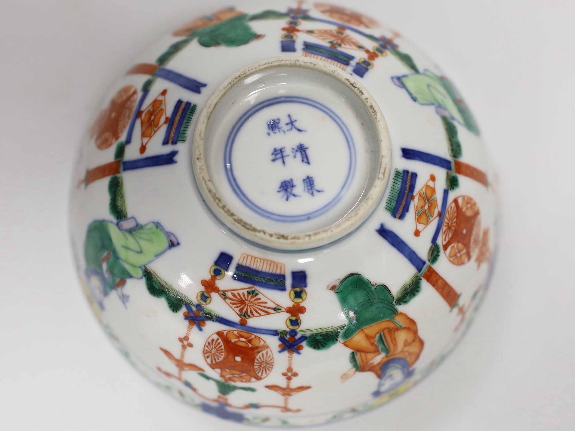 A Chinese wucai ‘boys’ bowl, Kangxi mark late 19th/early 20th century, dragon to the interior, 16.5cm diameter